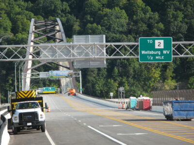 Warren Scott FINISHING TOUCHES — Crews recently striped the new Ohio River bridge, as seen from the intersection of Cleaver and Third streets in Brilliant, in preparation for its opening next week. After a day-long celebration Wednesday that will include music, food and a ribbon cutting by West Virginia Gov. Jim Justice, the span is slated to open to traffic on Thursday.